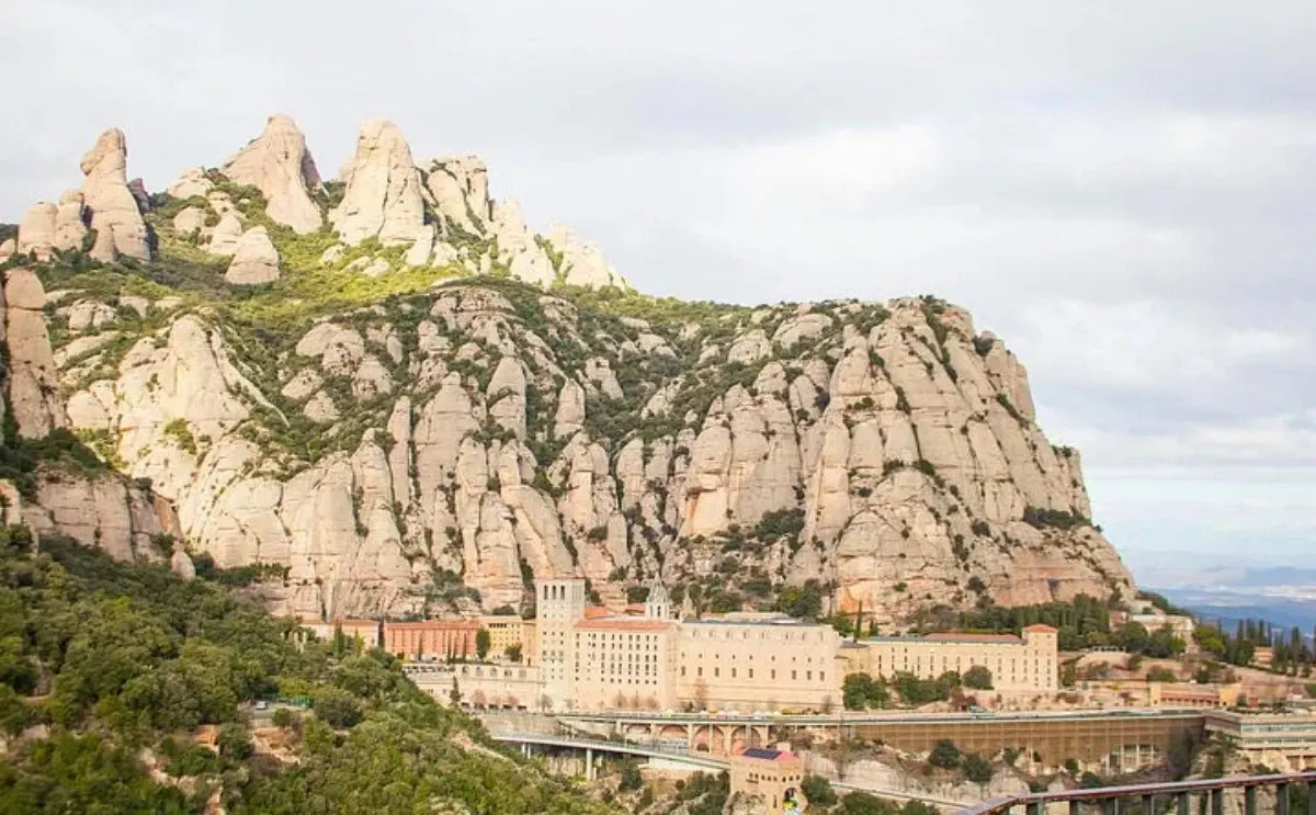 Montserrat Monastery nestled at the base of the unique rock formations of Montserrat Mountain, with its scenic setting drawing visitors from all over.