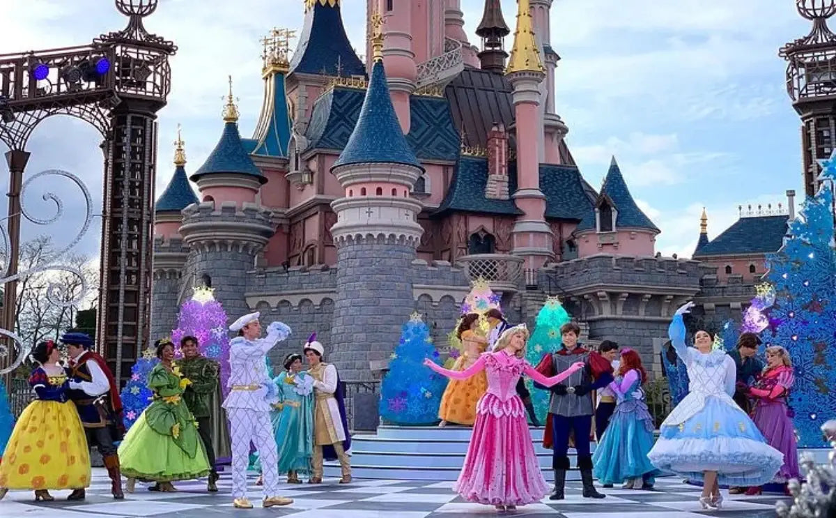 Beloved Disney characters perform a magical show in front of the Sleeping Beauty Castle at Disneyland Paris, enchanting the audience with vibrant costumes and captivating choreography.